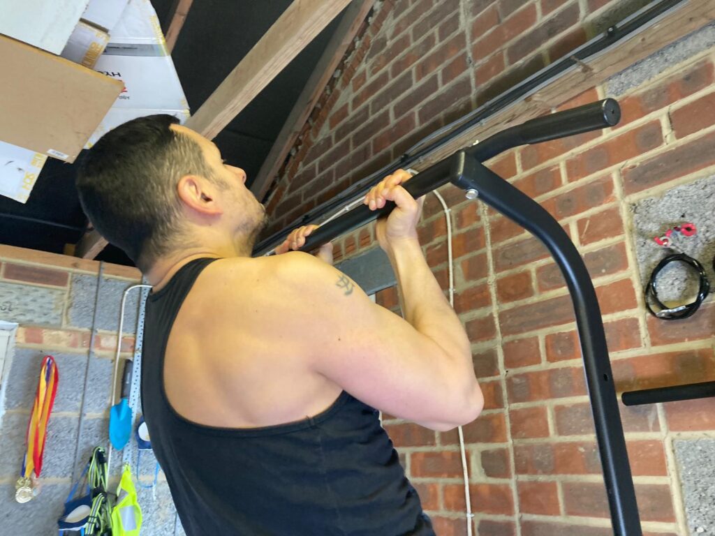man performs a pullup