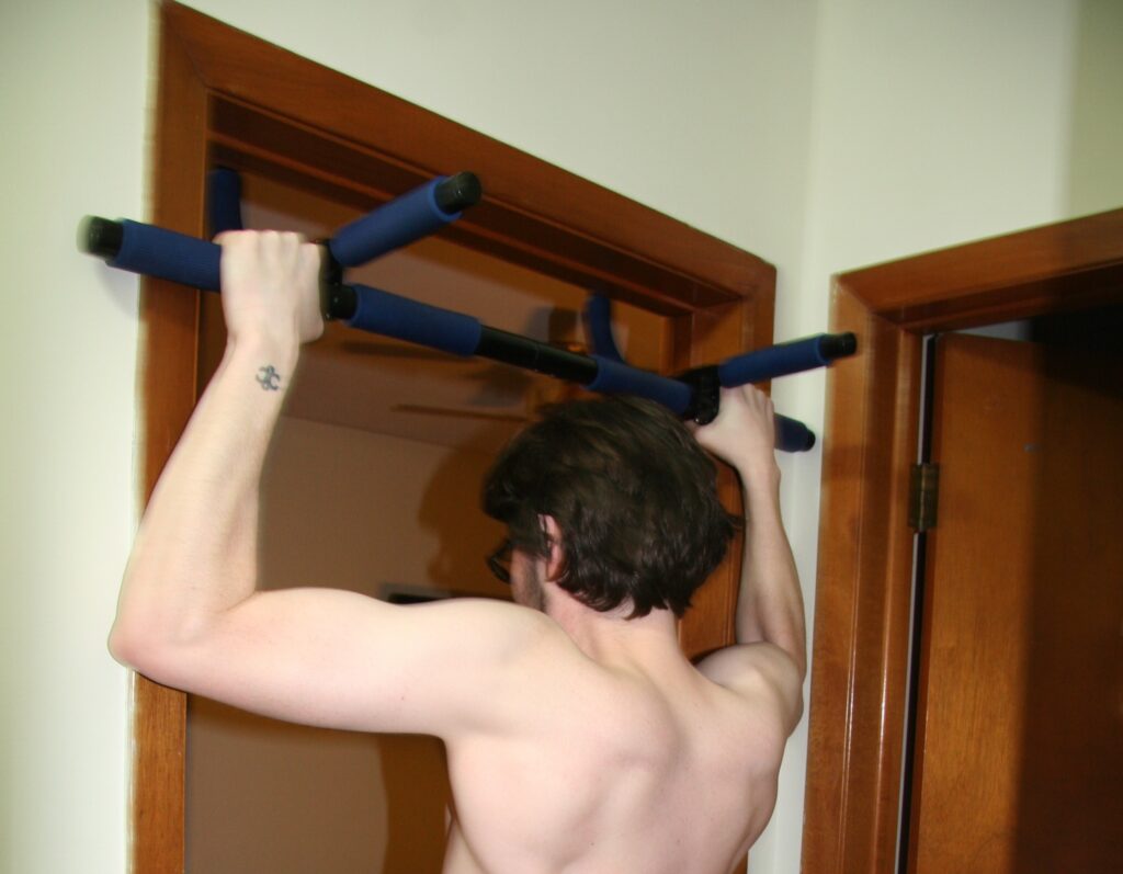 a home gym pullup bar mounted on a doorframe