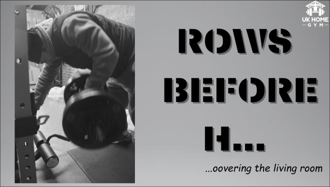 A man lifts a heavy dumbbell.